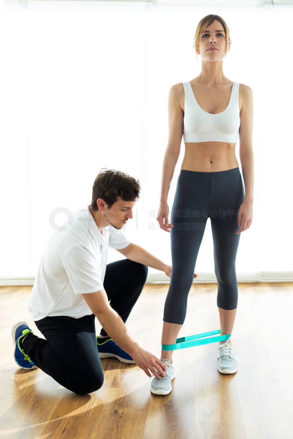 Young physiotherapist giving advice his female patient during bo