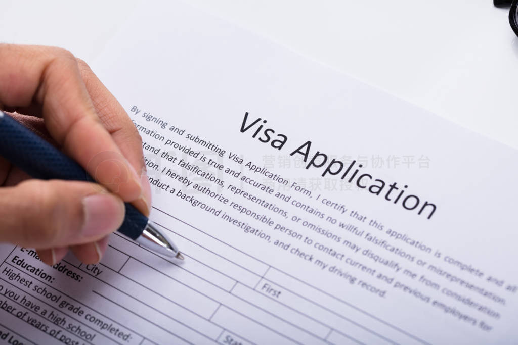 s Hand Filling Visa Application Form