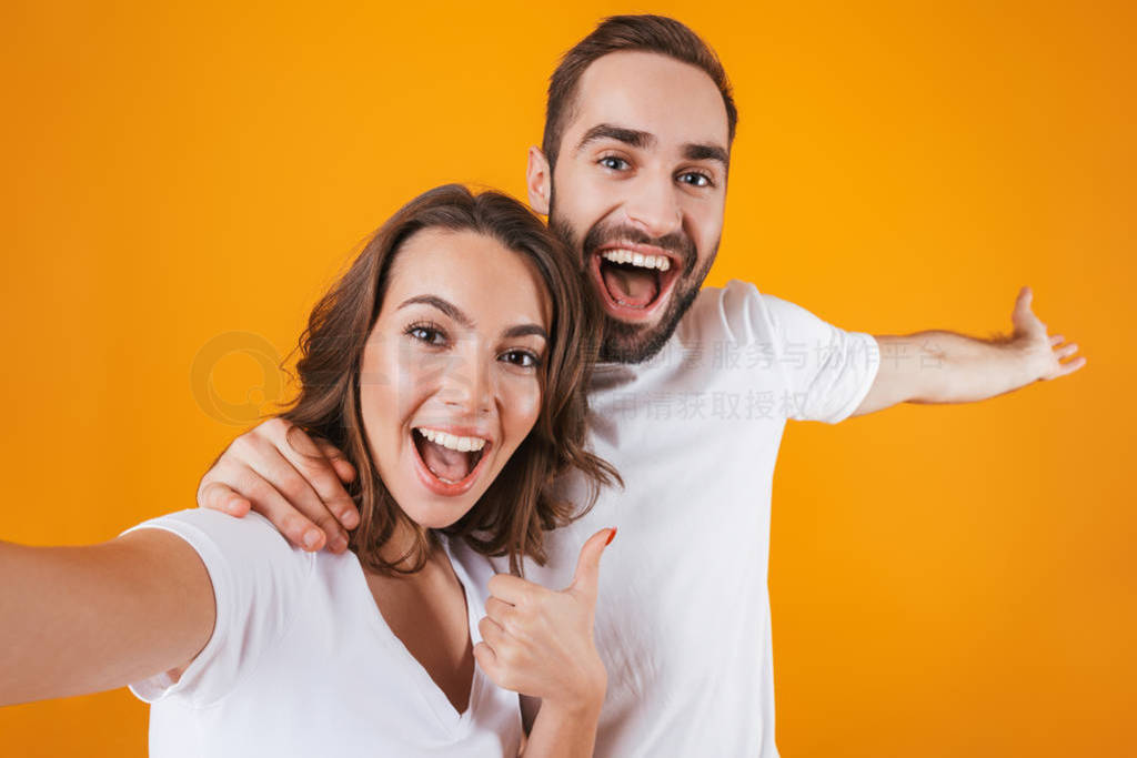 Portrait of two happy people man and woman smiling while taking