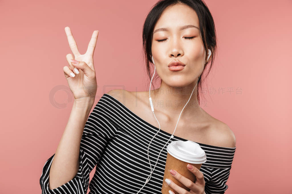 Photo of pretty asian woman dressed in basic wear showing peace