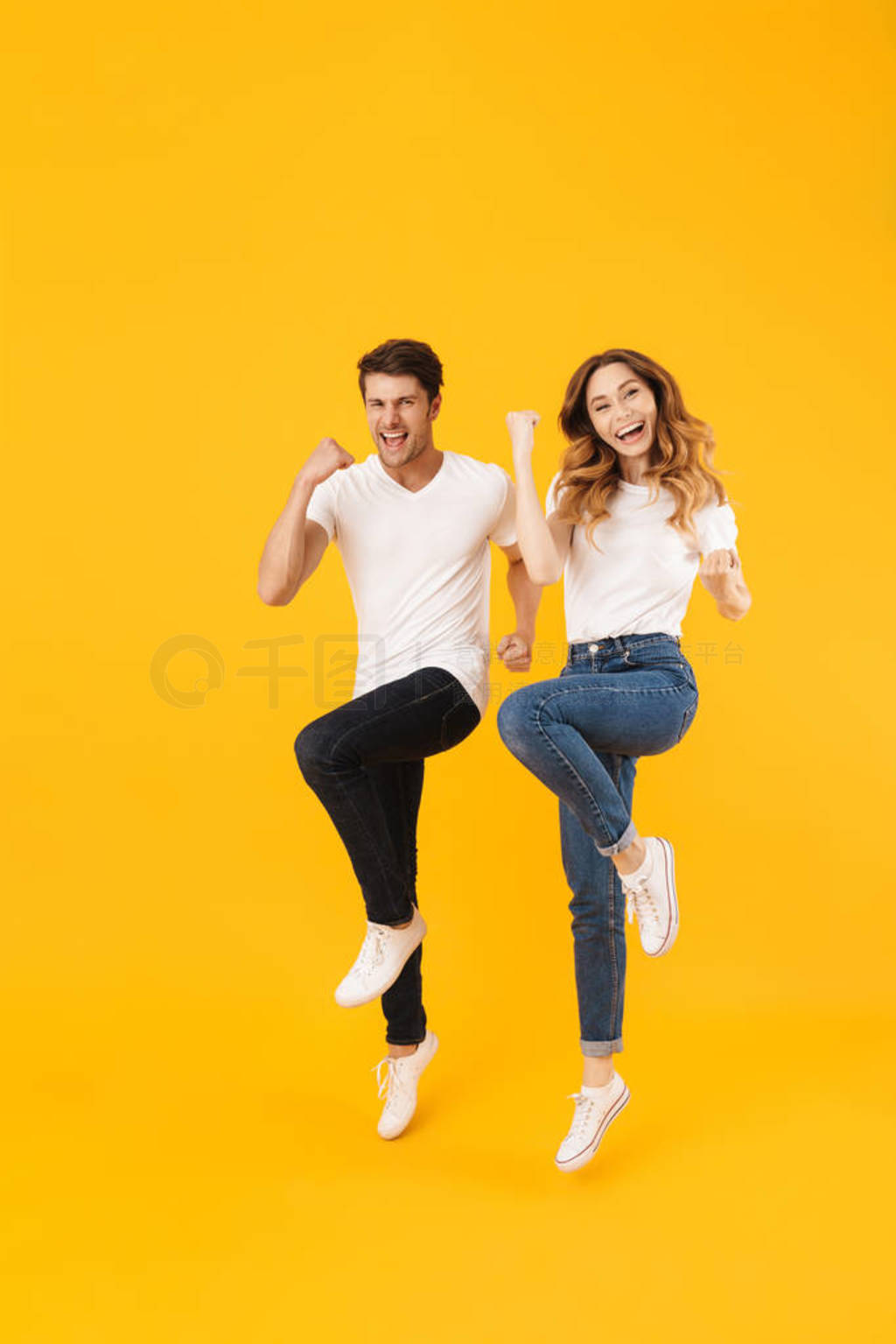 Full length portrait of delighted couple man and woman in basic