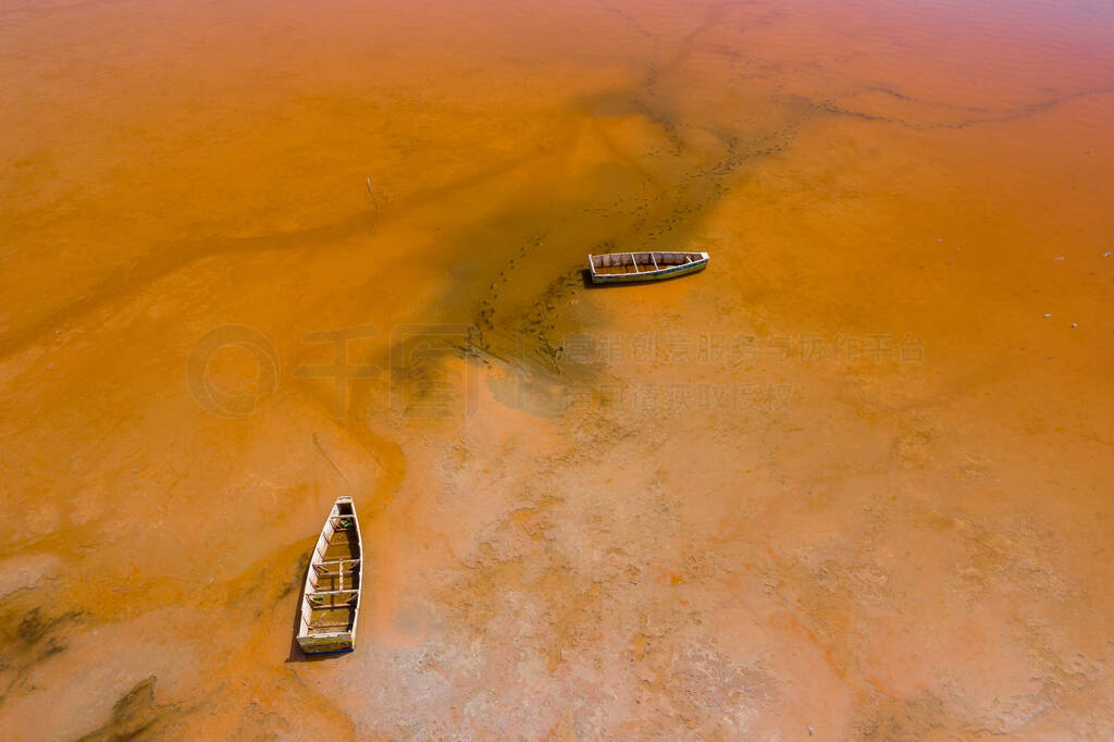 Aerial view of the small boats for salt collecting at pink Lake