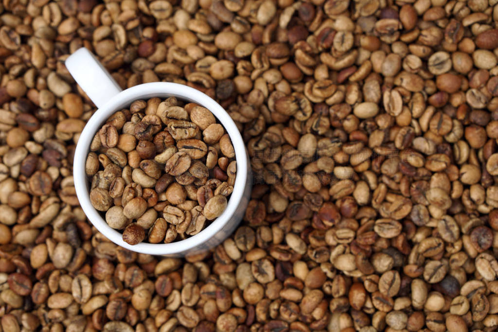 medium roasted coffee beans with white porcelain cup