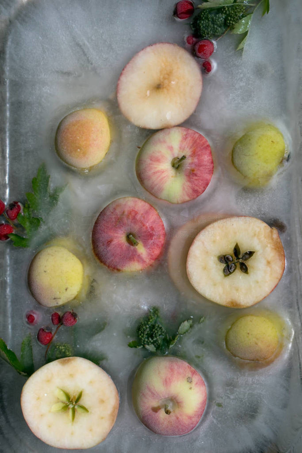 Background fresh season apple frozen in ice