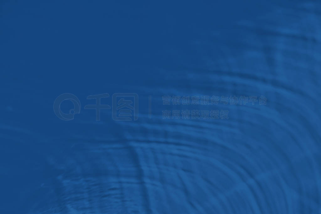 blue colored abstract background with light and shadows caustic