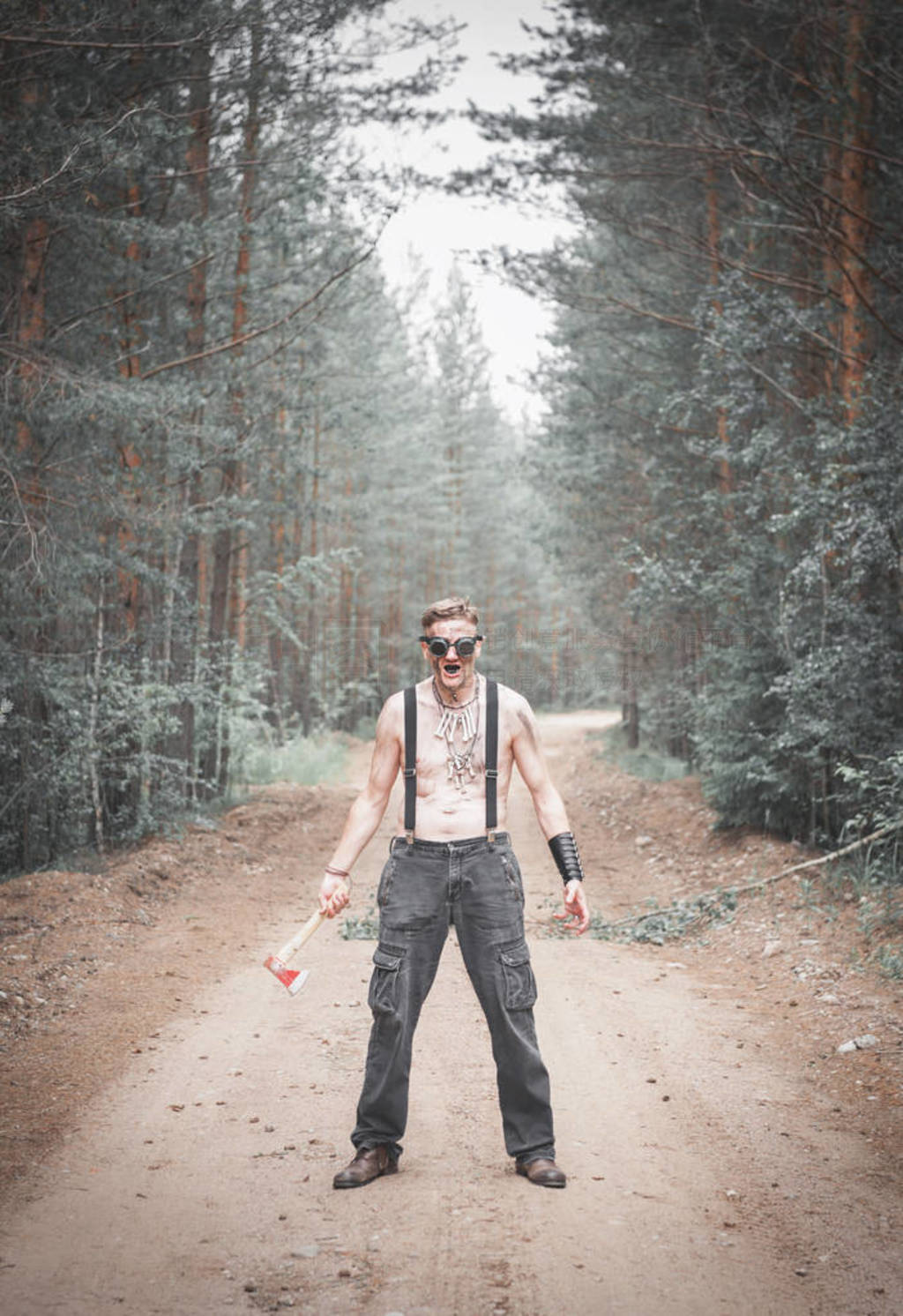 Cannibal steampunk Man in glasses with ax in forest