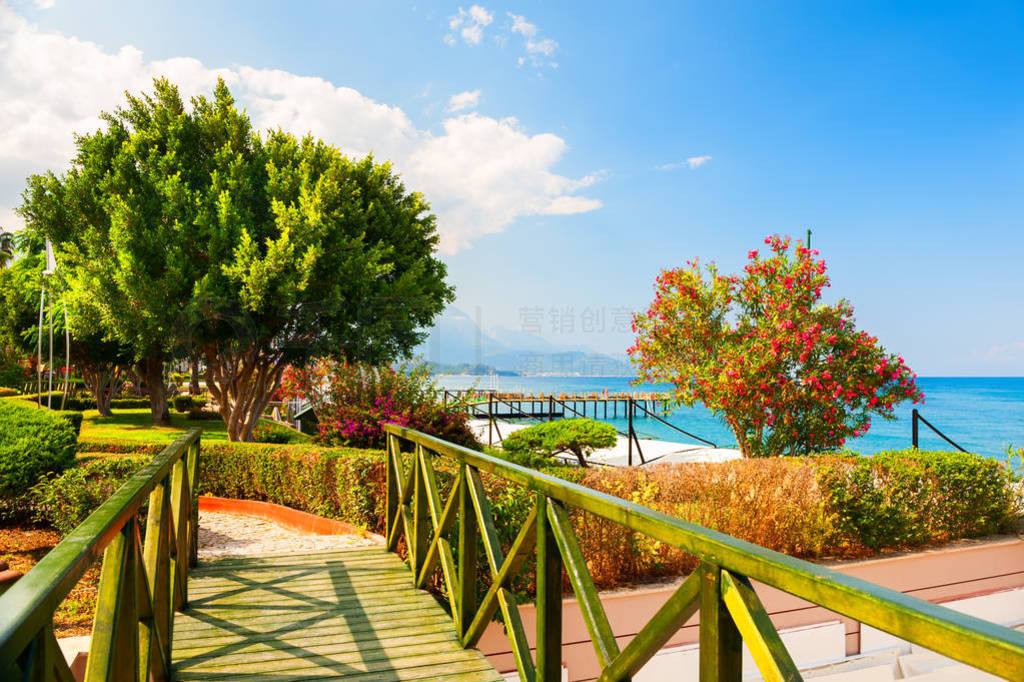 Beautiful sea promenade with green trees in Kemer, Turkey.