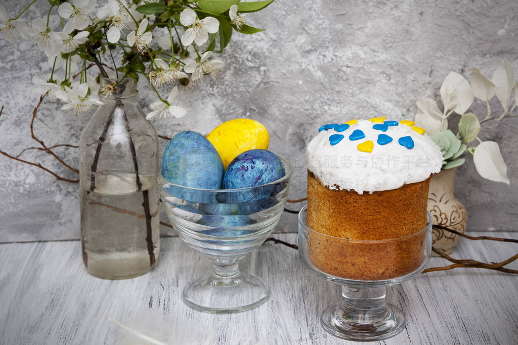 Traditional Easter cake with colored powder and colored eggs in