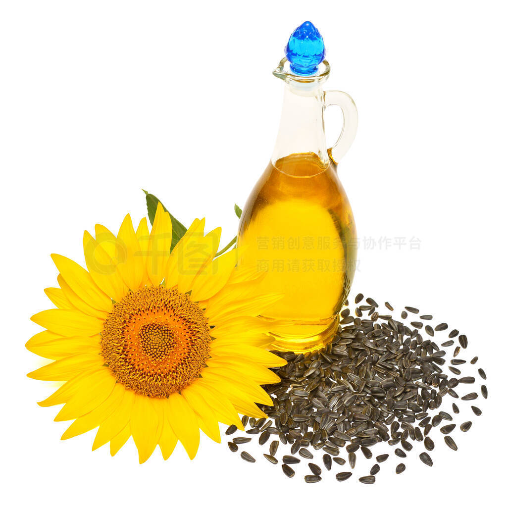 Creative idea flower of a sunflower, seeds and oil glass bottle