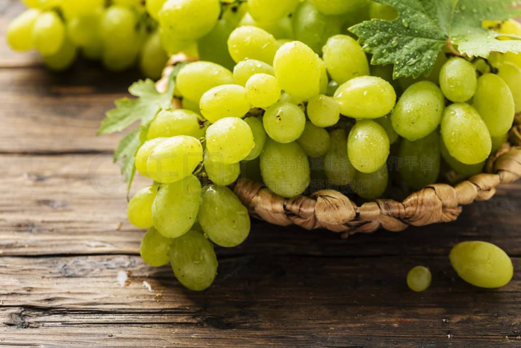 Sweet yellow grape with leaves