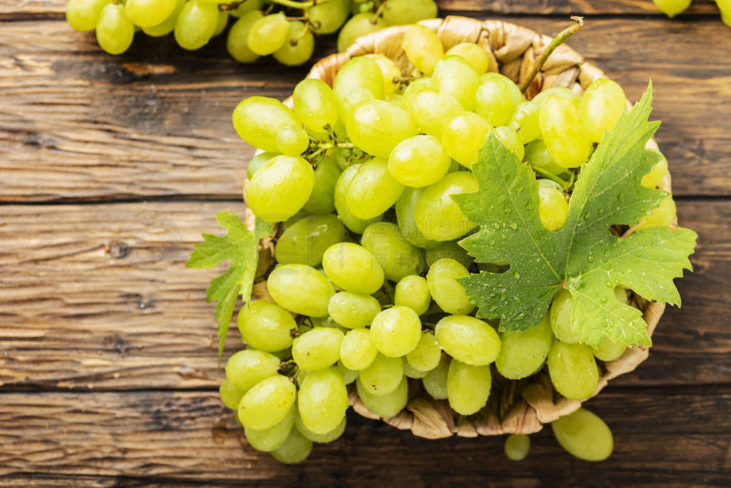 Sweet yellow grape with leaves