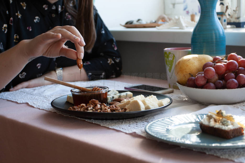 A gourmet lunch: a black plate of appetizers