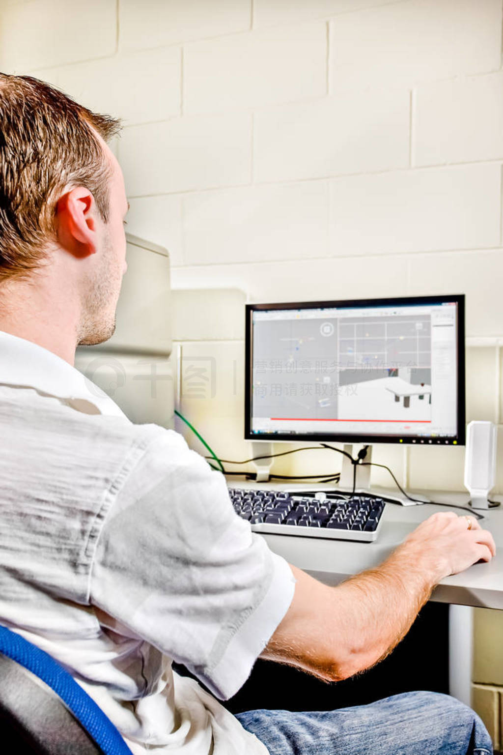 Back view of a computer operator works