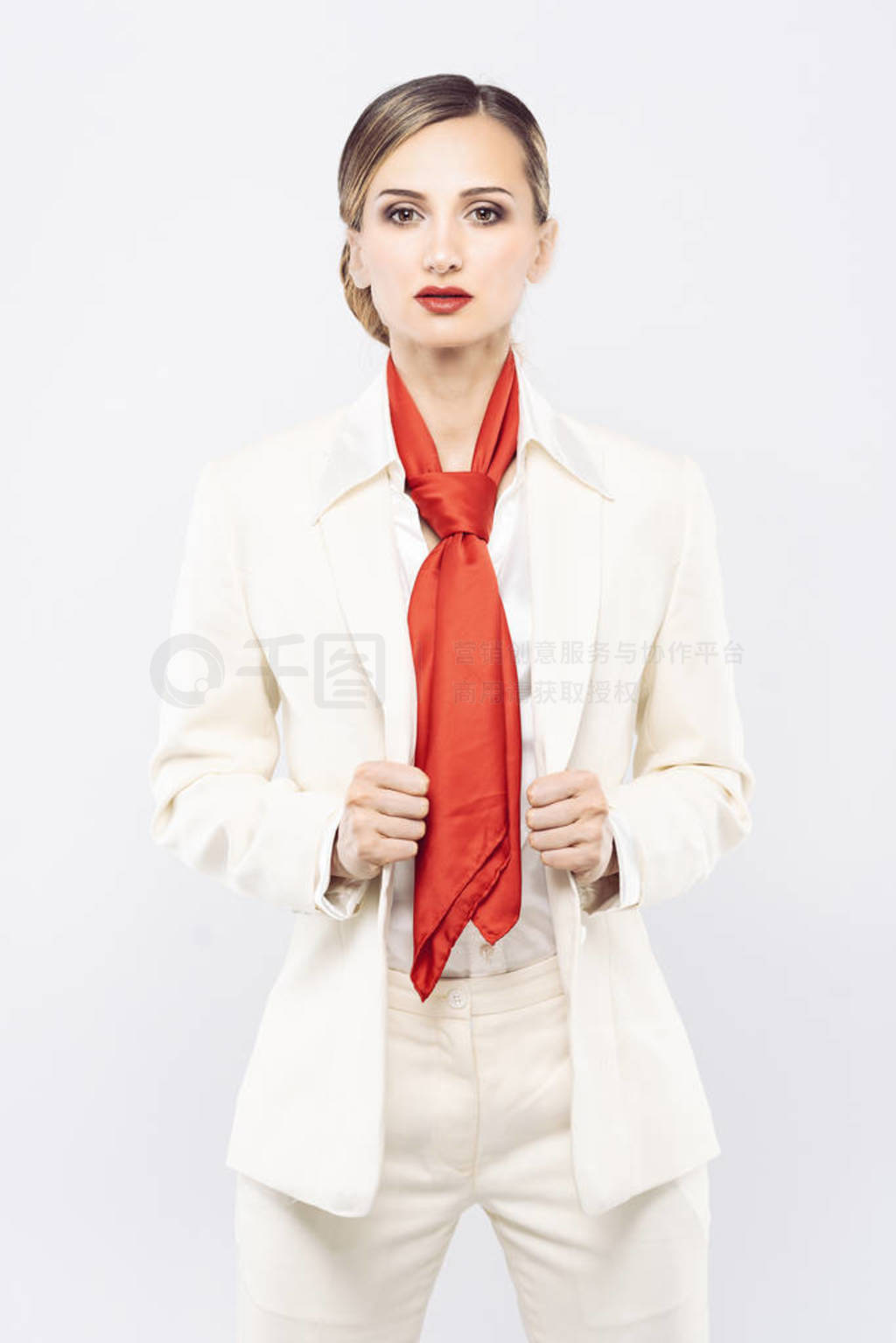 Elegant and expensive model wearing white business suit