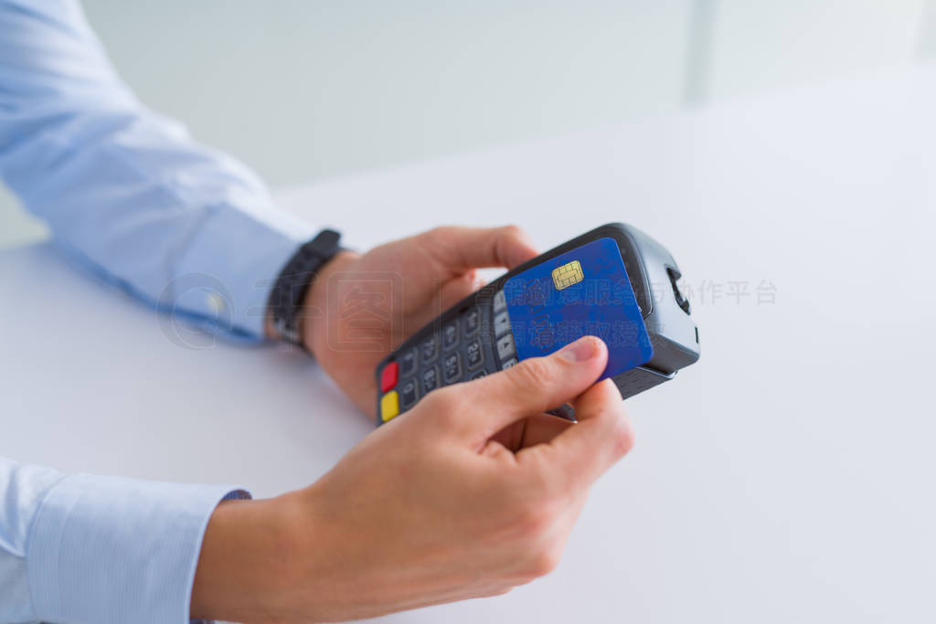 Close up of man hands holding pos terminal