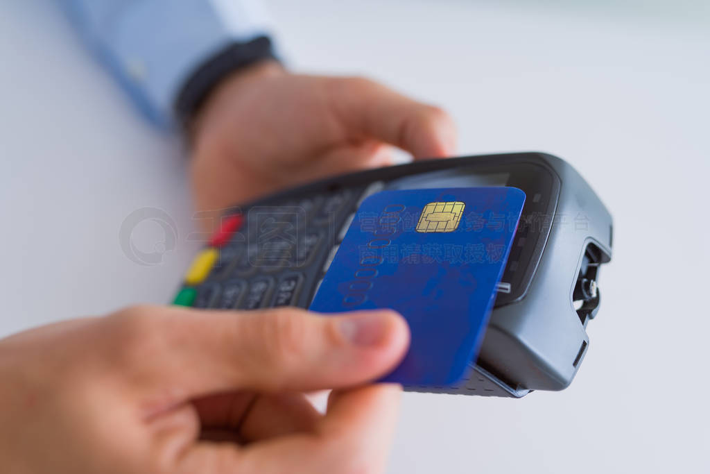 Close up of man hands holding pos terminal