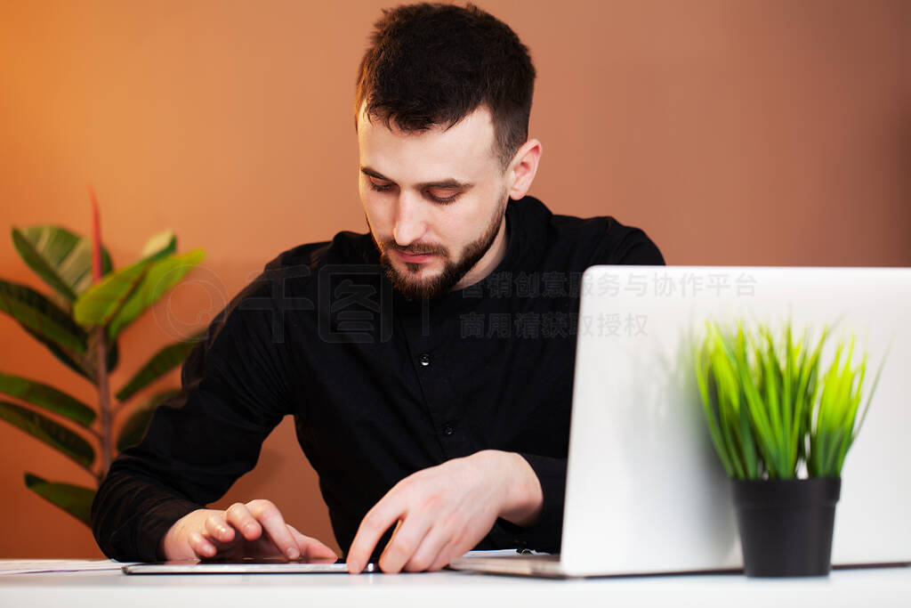 Employee works at the computer in office