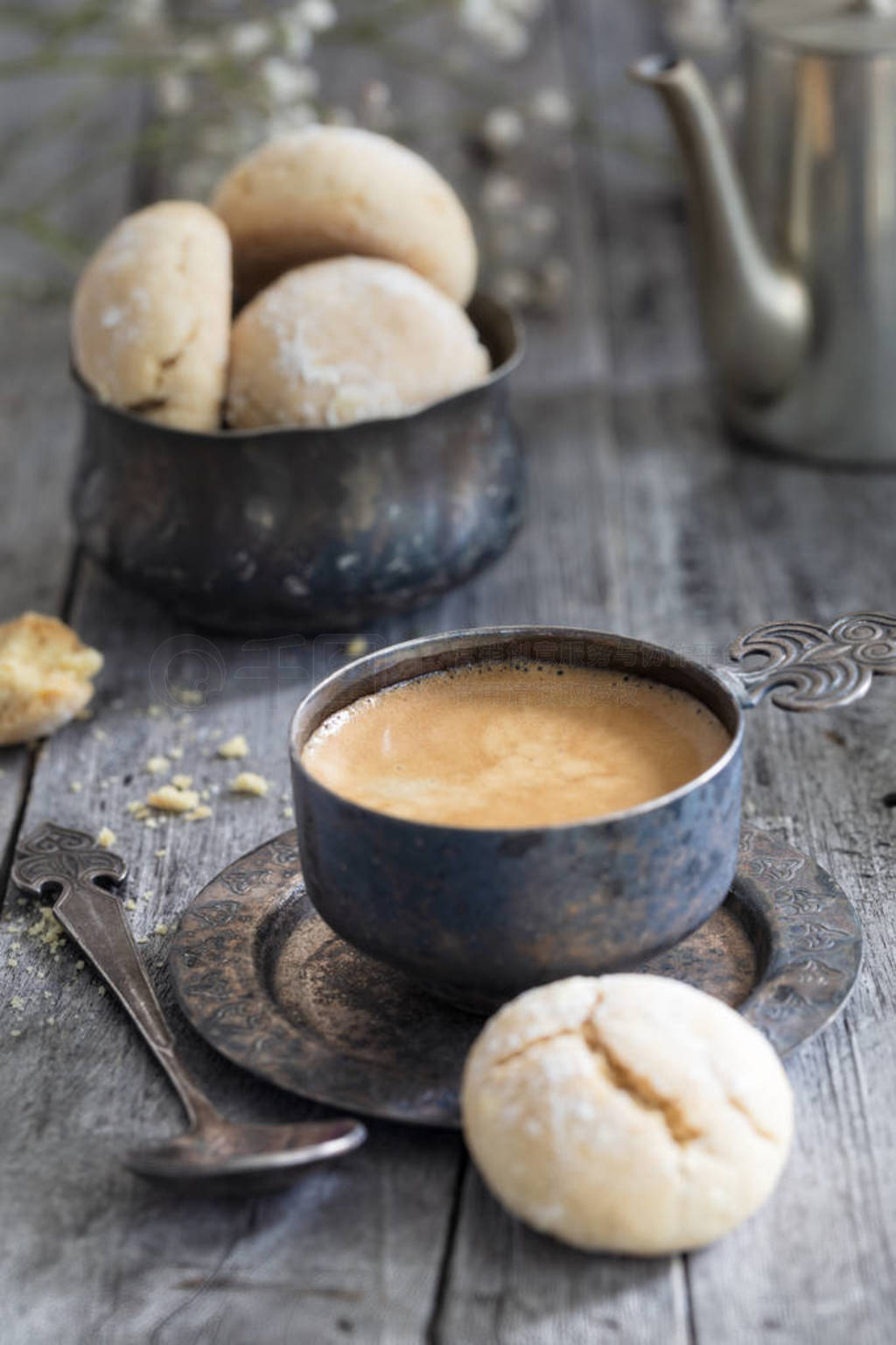 Metal Cup of coffee, pot and cookie on wooden rustic background