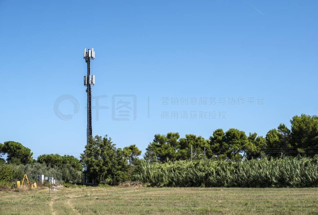 Telecommunication 5G transmitters. GSM antenna on blue sky.