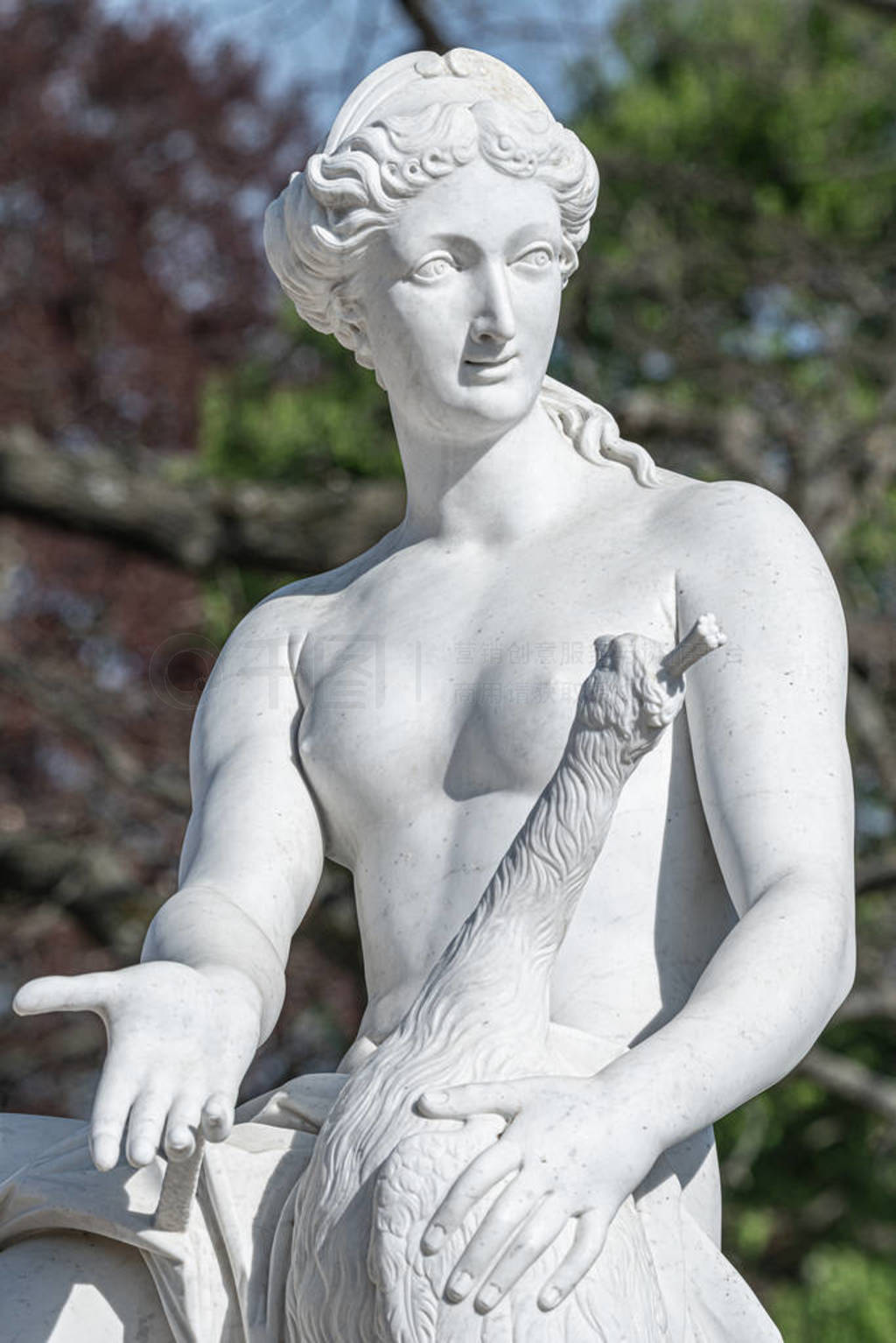Old statue of a sensual naked Renaissance Era woman in the park