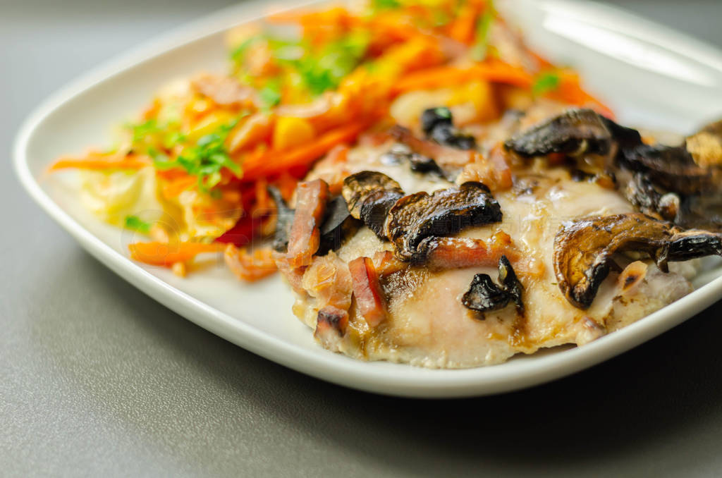 Chicken breast with sliced mushrooms, ham, in cheese sauce with