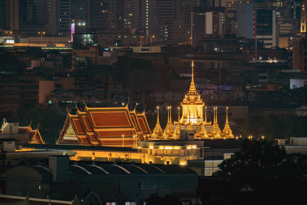 Loha Prasat, Wat Ratchanatda, and skyscraper buildings at night