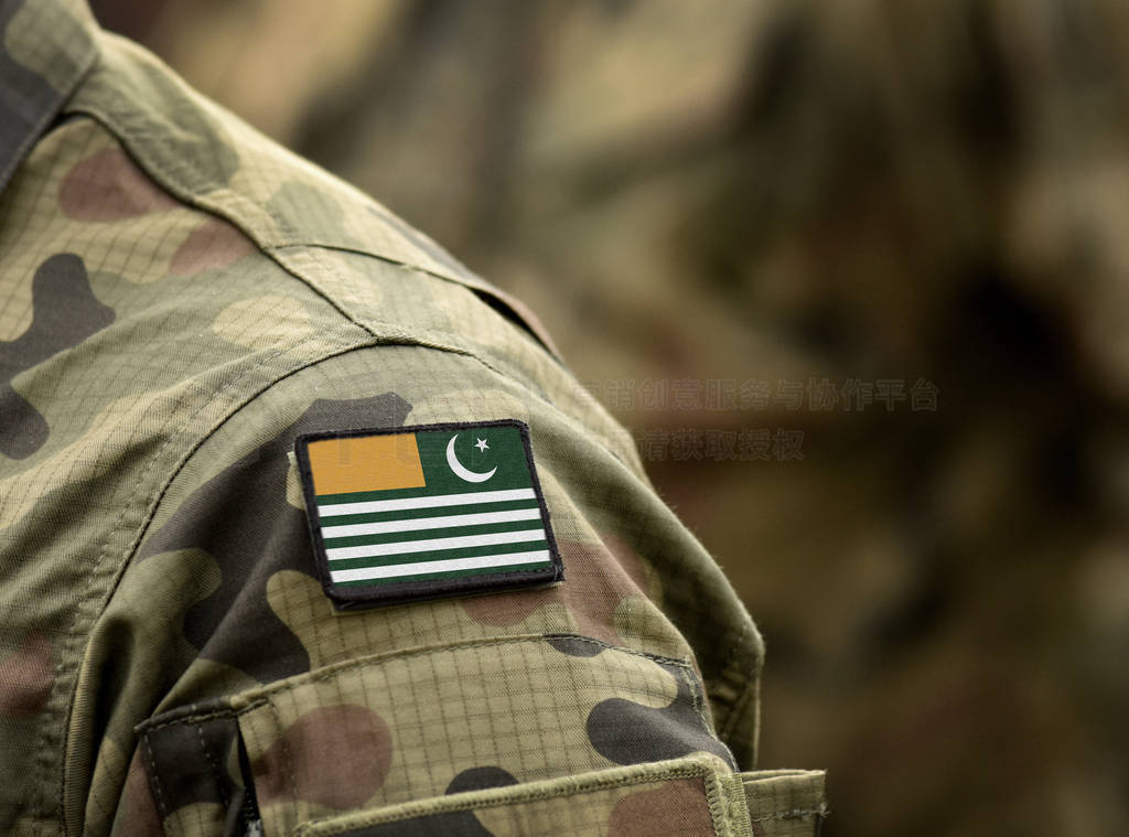Flag of Azad Kashmir on military uniform.