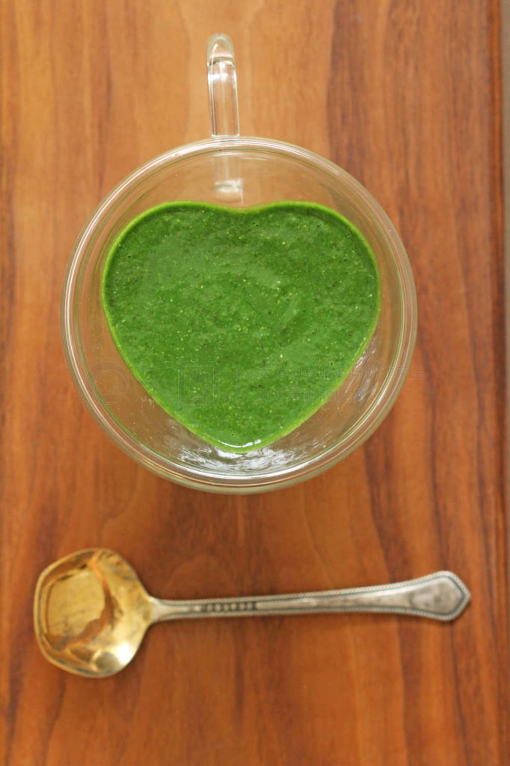 Spinach smoothie on wooden background. Fruit green smoothies in