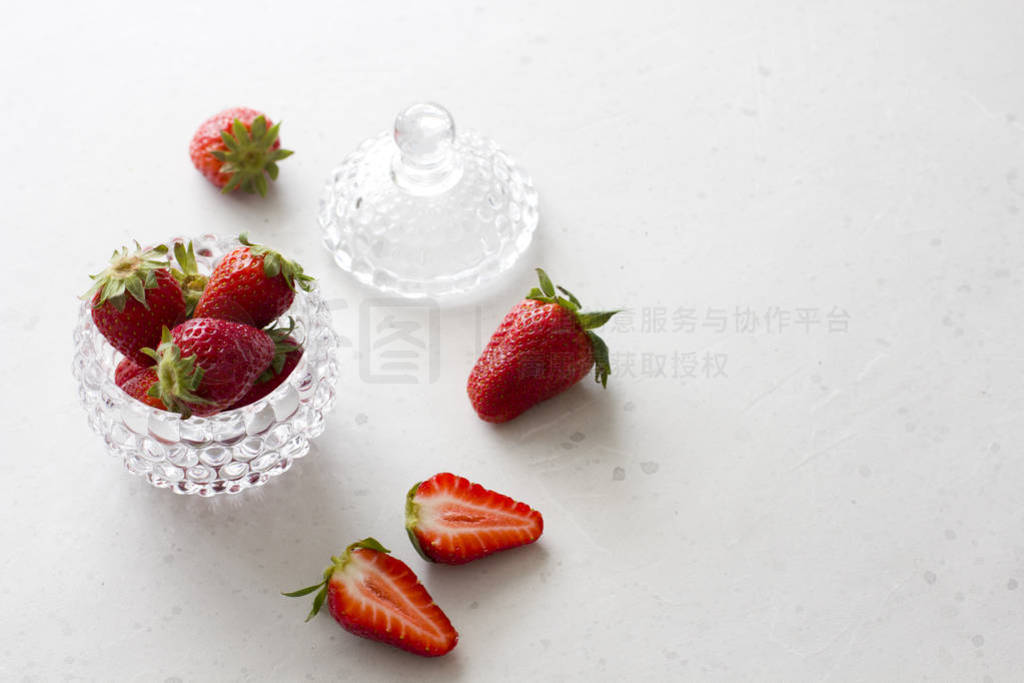 Beautiful red strawberry in glass round bowl. Strawberries on a