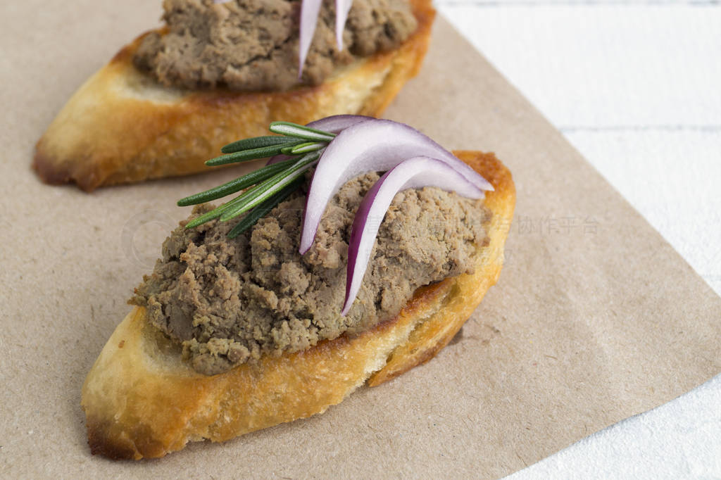 homemade meat pate on toasted crusty bread.