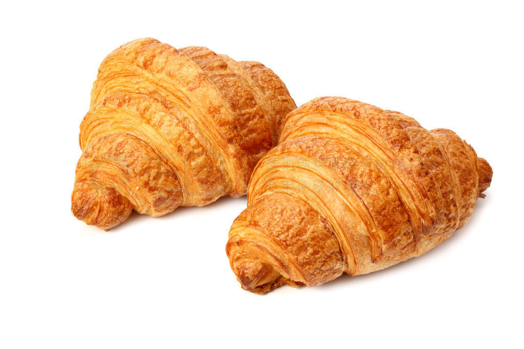 two fresh croissants isolated on white background