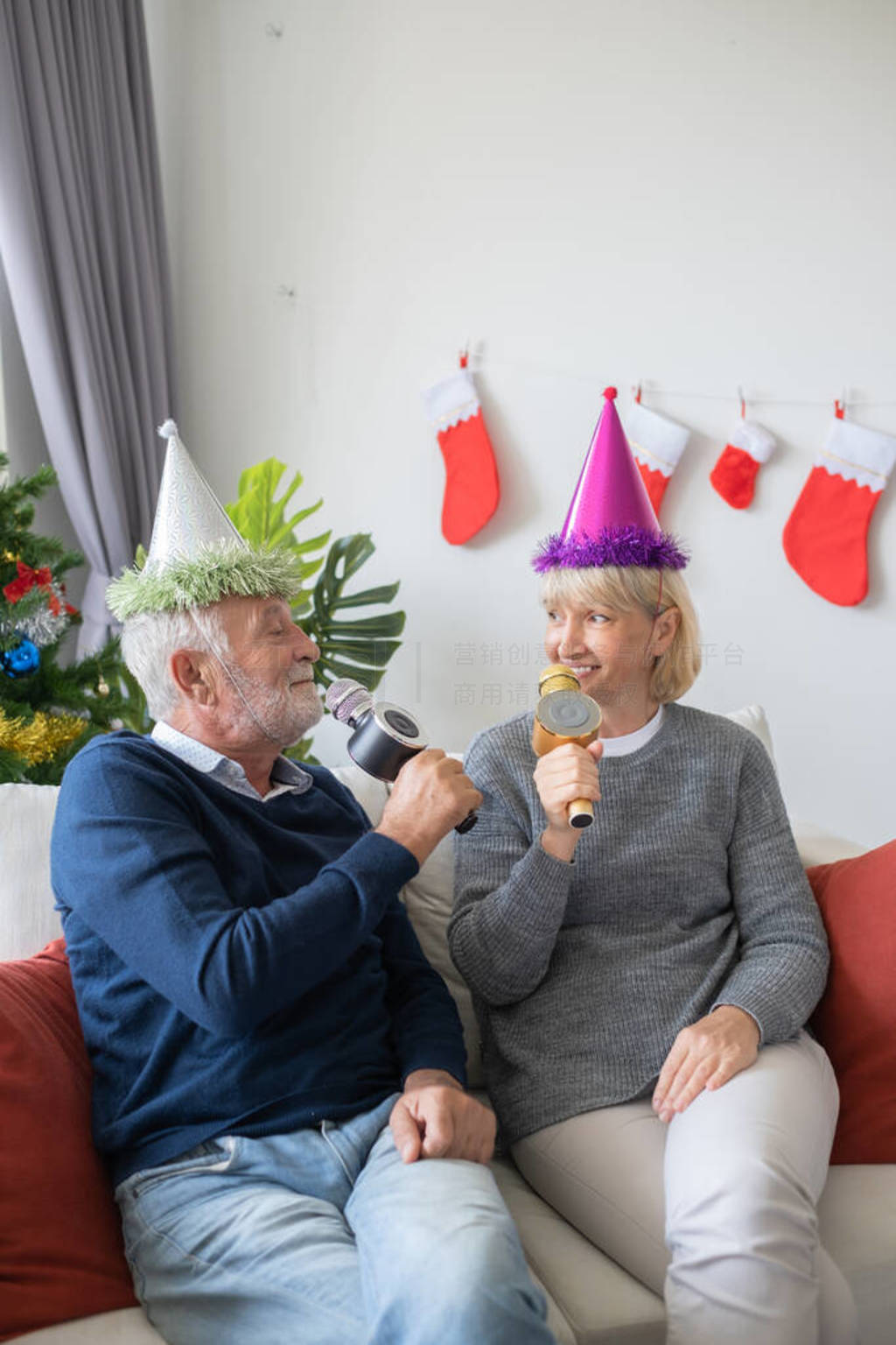 senior elderly caucasian old man and woman happy to sing a song