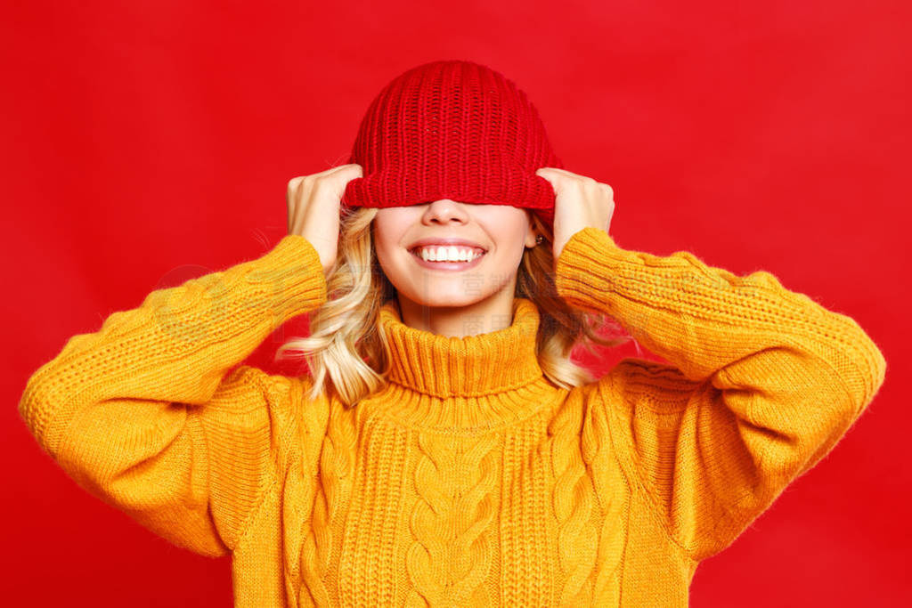 happy emotional cheerful girl laughing with knitted autumn cap