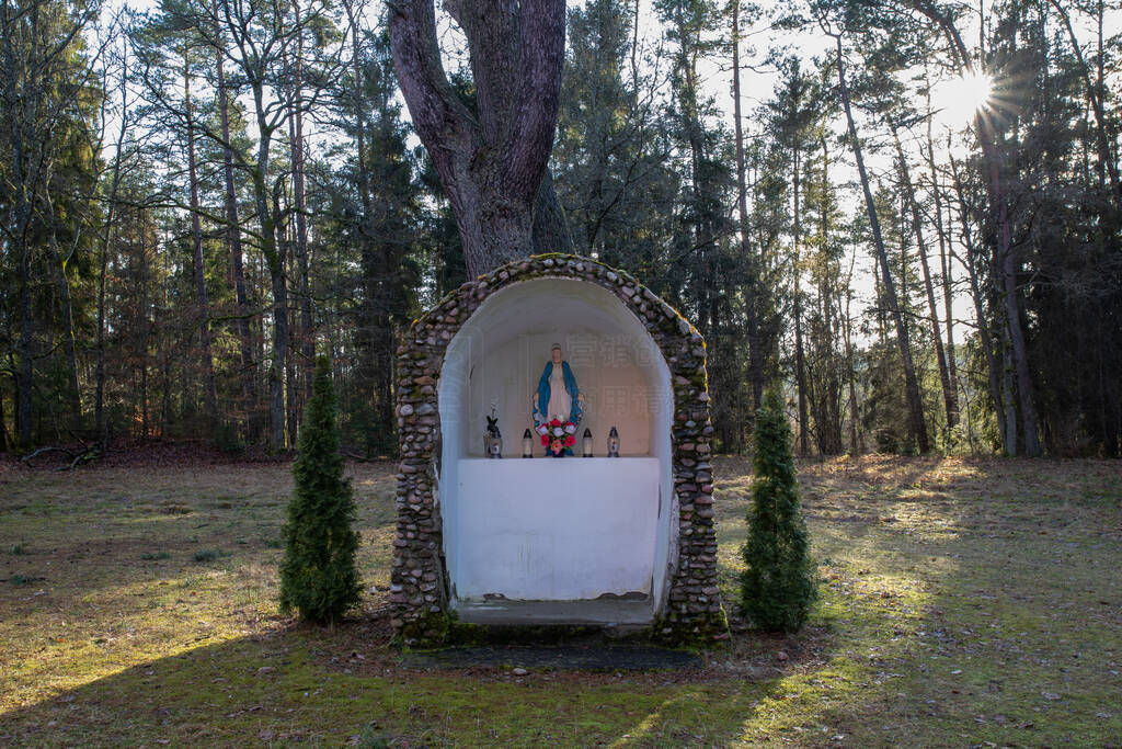 Catholic chapel in the forest. Place of prayer of Christians.