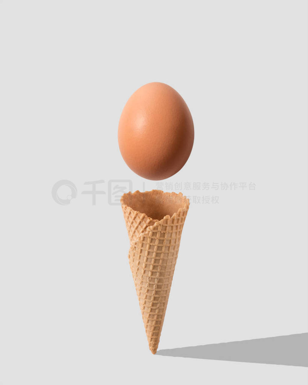 Ice cream cone with egg on white background. Minimal food concep