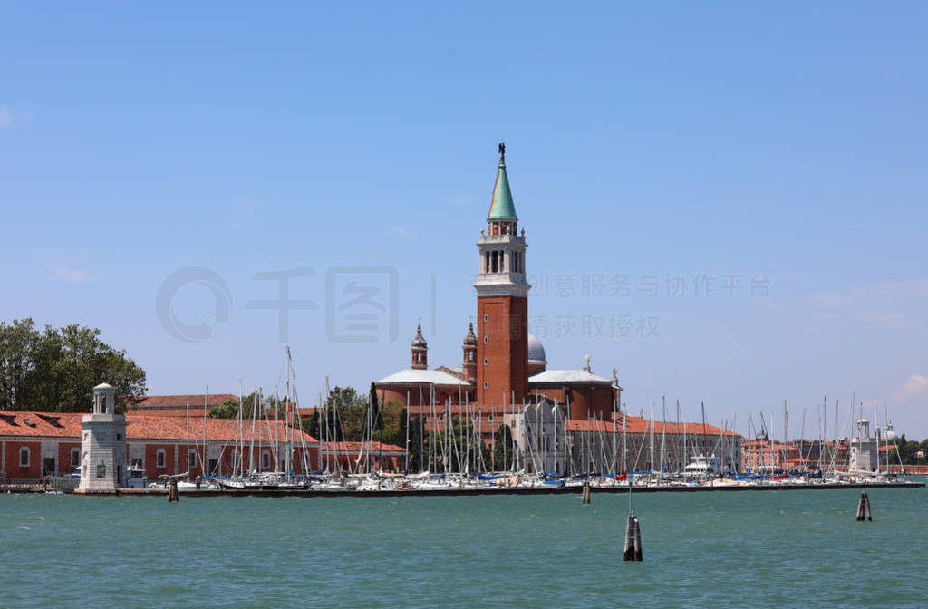 Saint George Church with many boats moored on the harbor on the