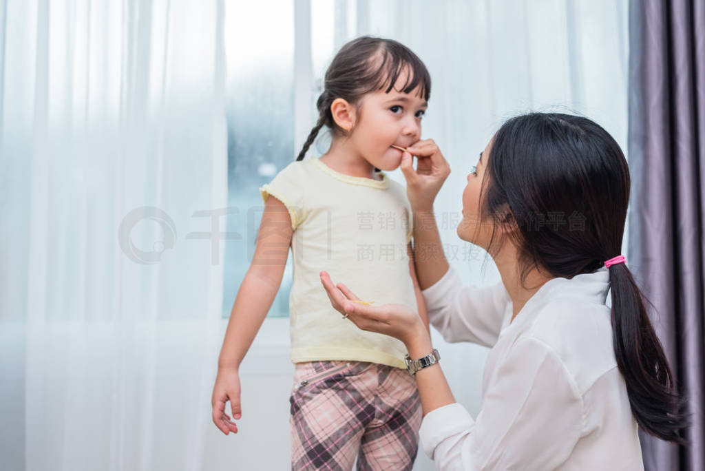 Mom feeding kids with potato chip. Teacher feeding student with