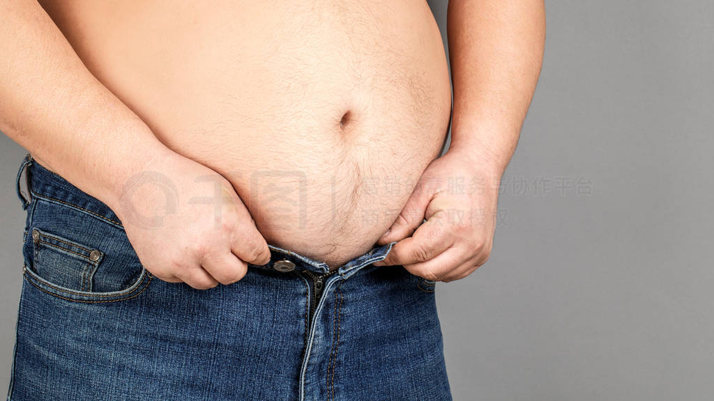 An overweight person can't pull down his pants because of belly