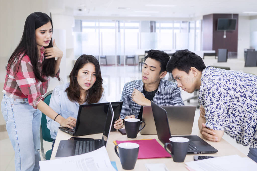 Young business people discussing in the office