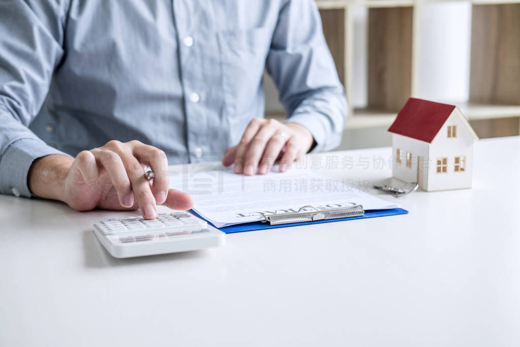 Businessman working doing finances and calculation cost of real