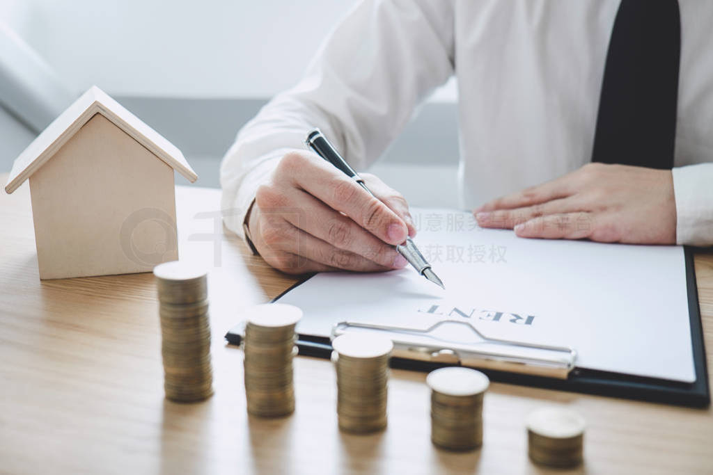 Businessman working doing finances and calculation cost of real