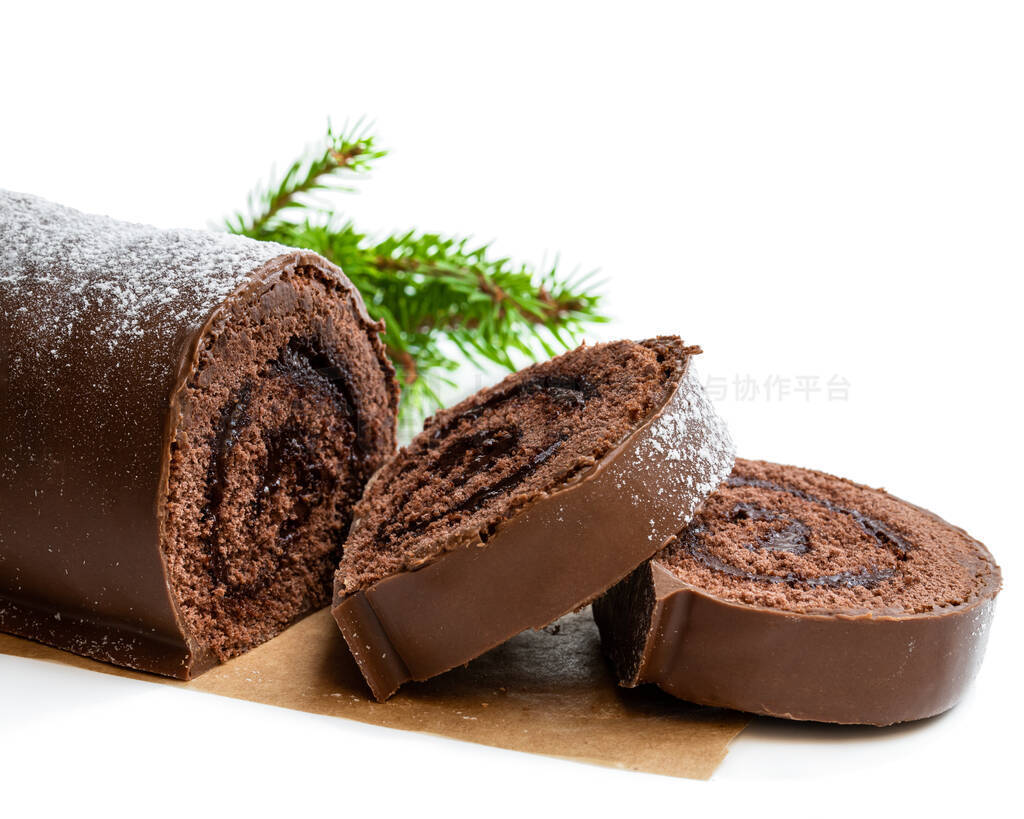 Chocolate yule log christmas cake coated with milk chocolate iso