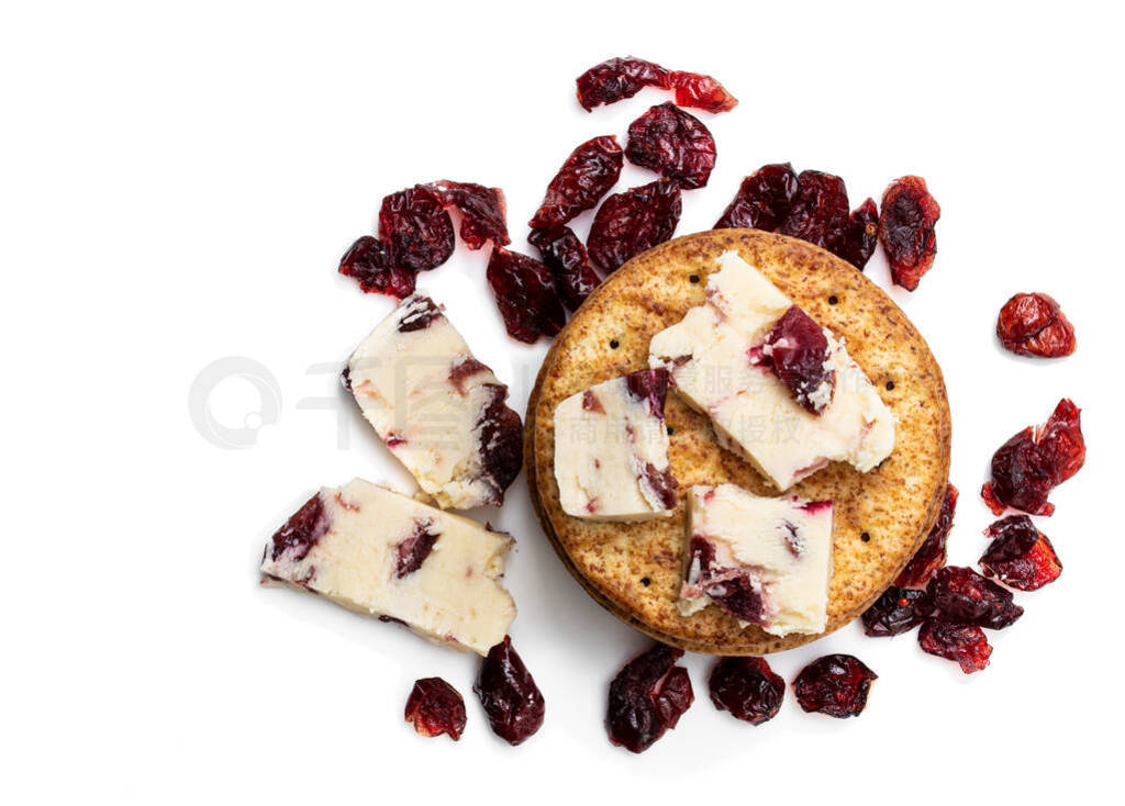 Cranberry cheddar cheese with wheat crackers isolated on white.