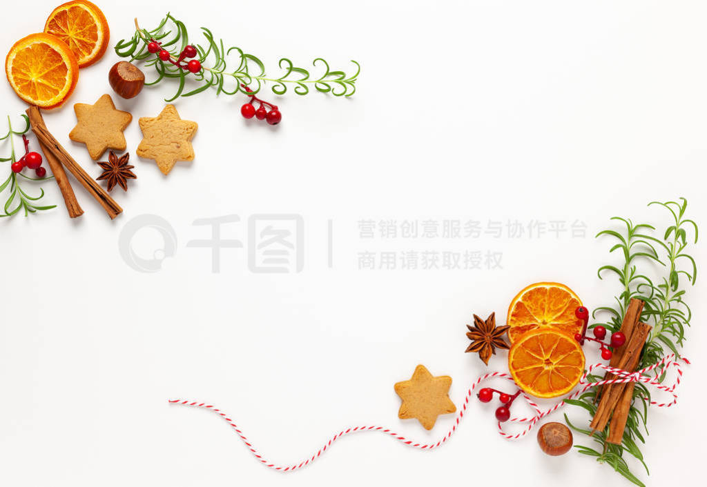 Christmas composition with cookies, dried oranges, cinnamon sti
