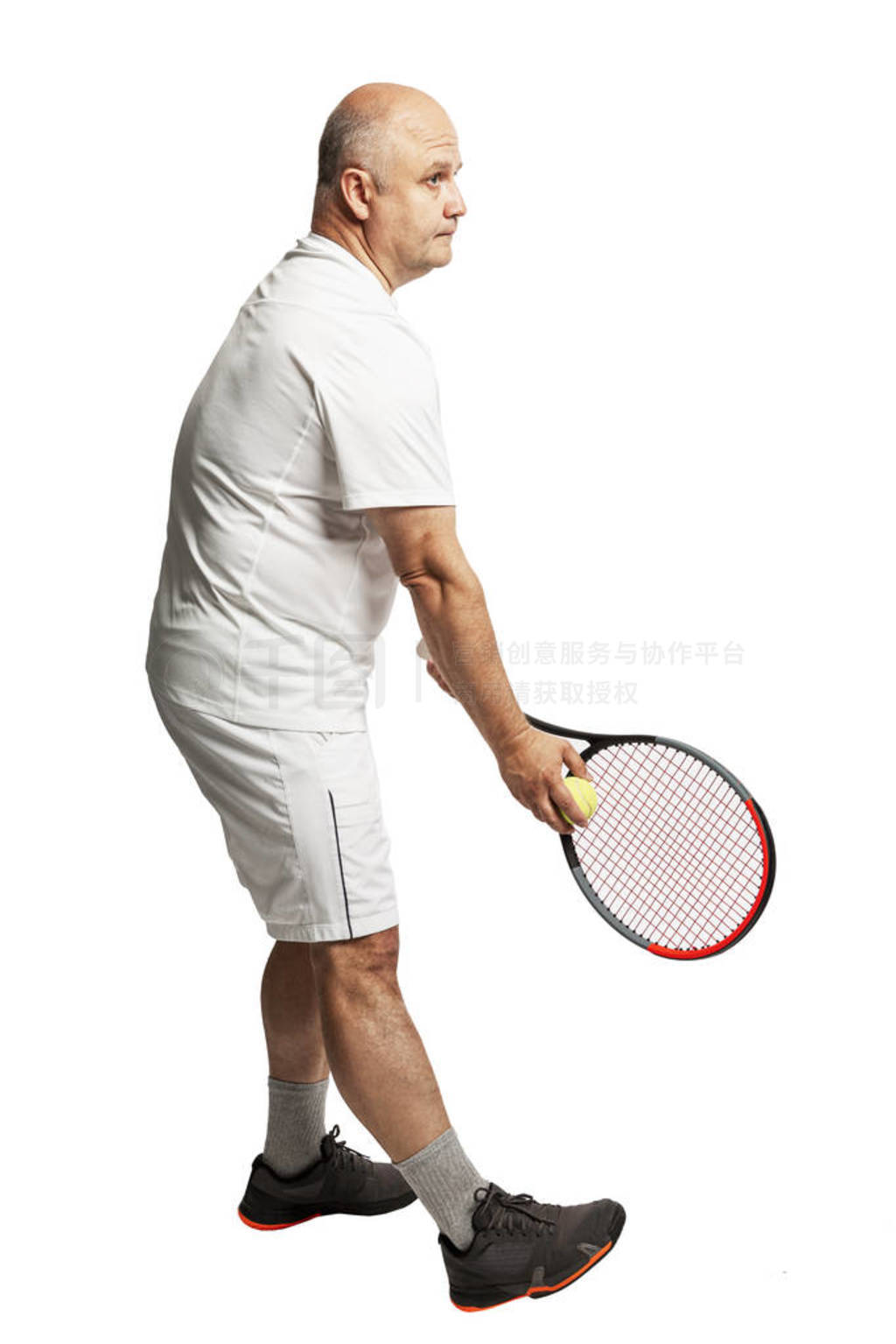 A bald man in adulthood in a white sports uniform with a tennis