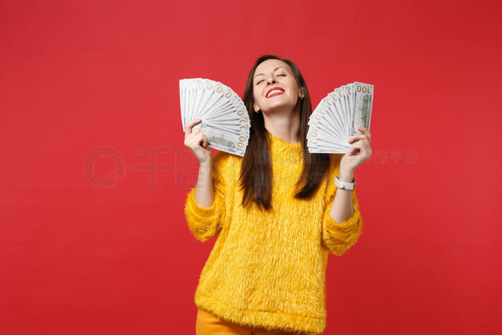 Relaxed young woman in fur sweater with closed eyes holding fan