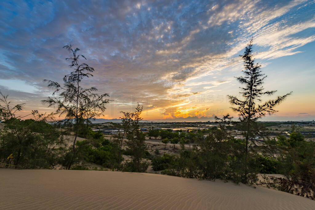 Scenery of sand dune with amazing sunset background