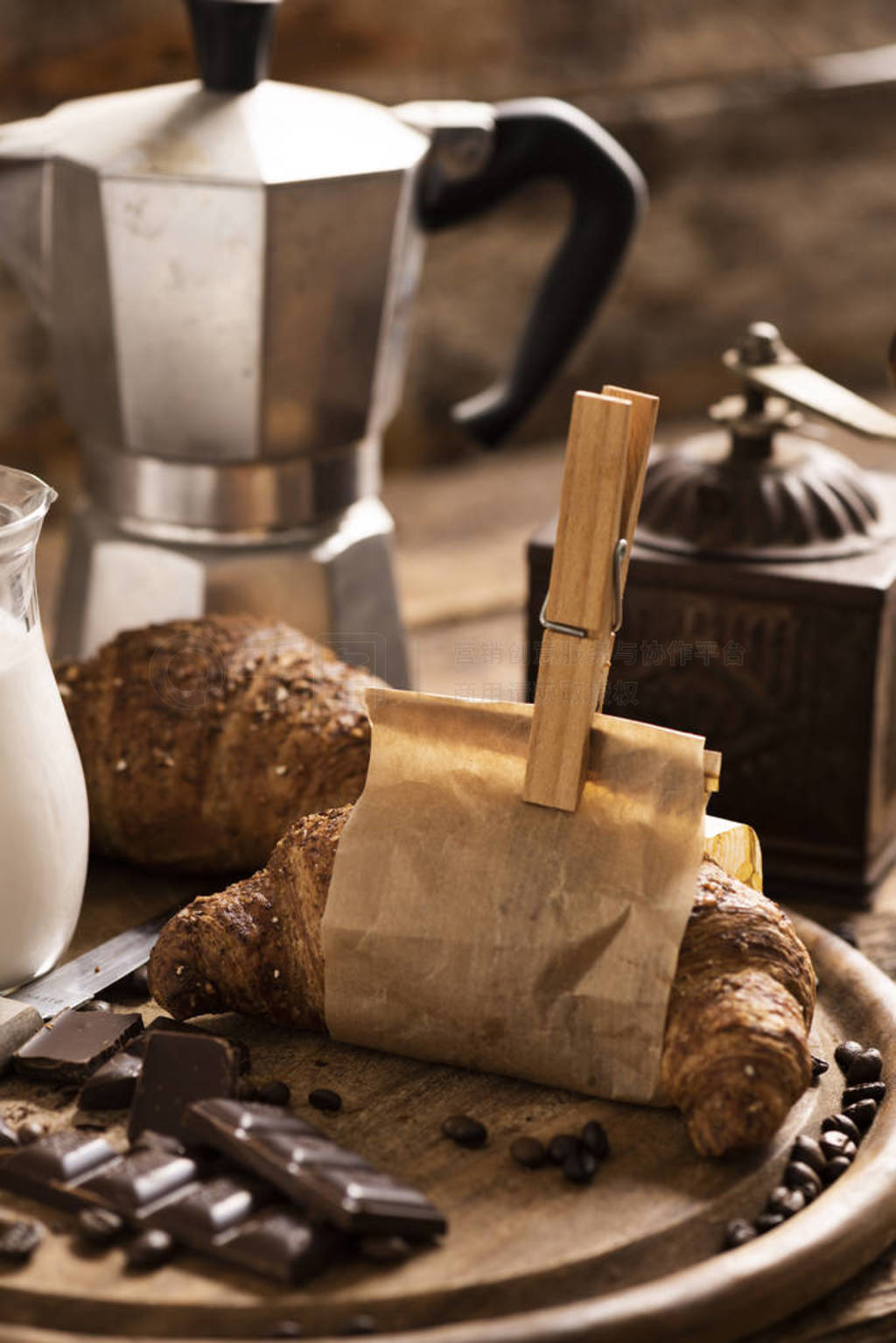 Coffee cup with a croissant and fresh coffee