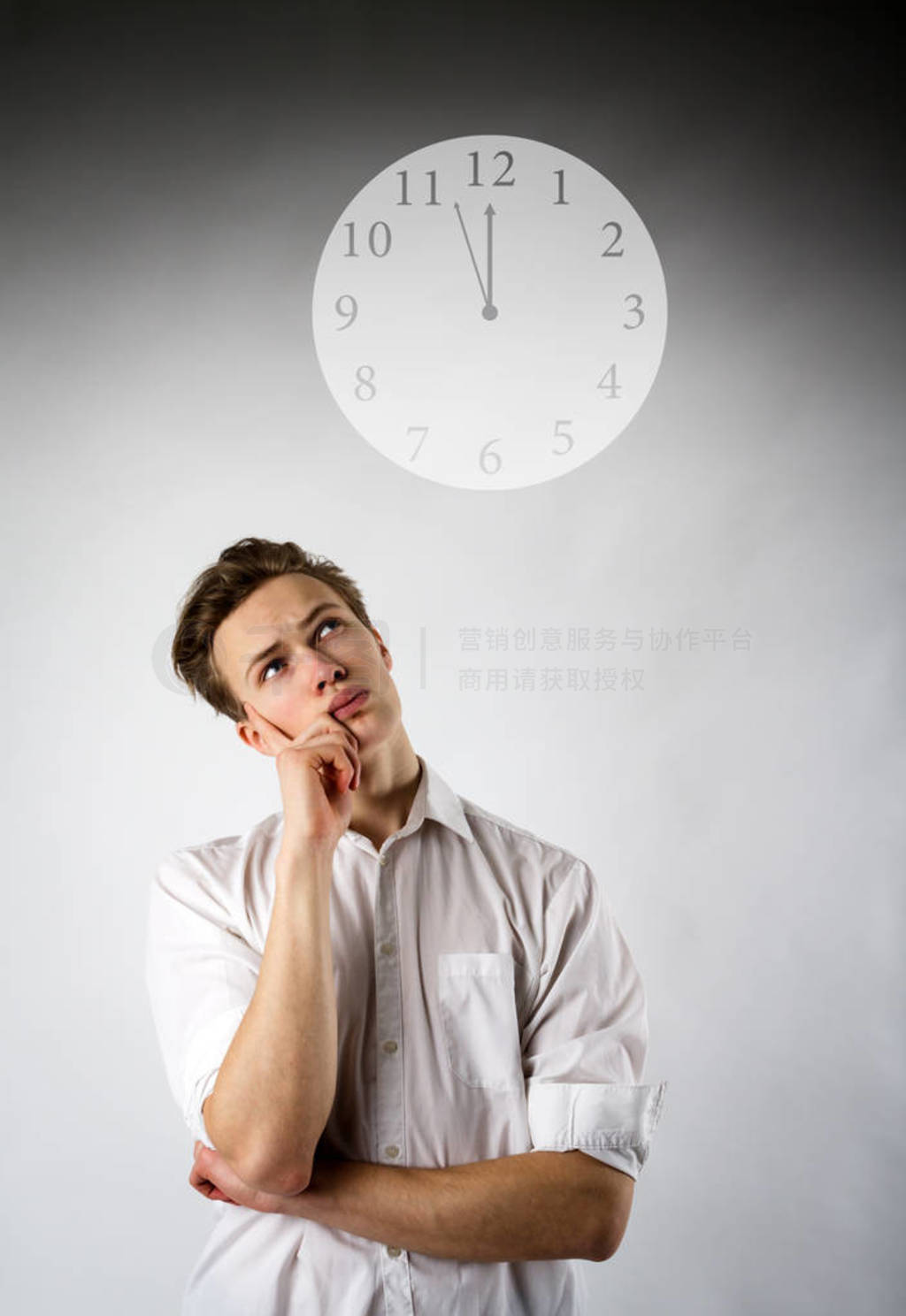 Young man in white and clock.