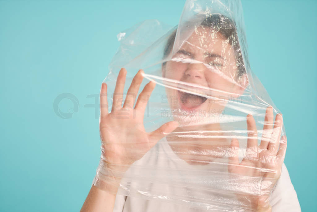 Afraid emotional girl scared screaming choking in plastic bag ov